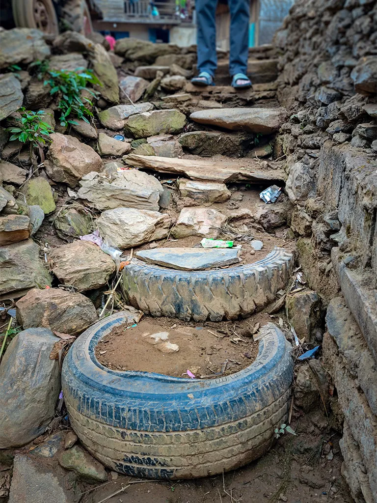 old tyres used as steps to the village