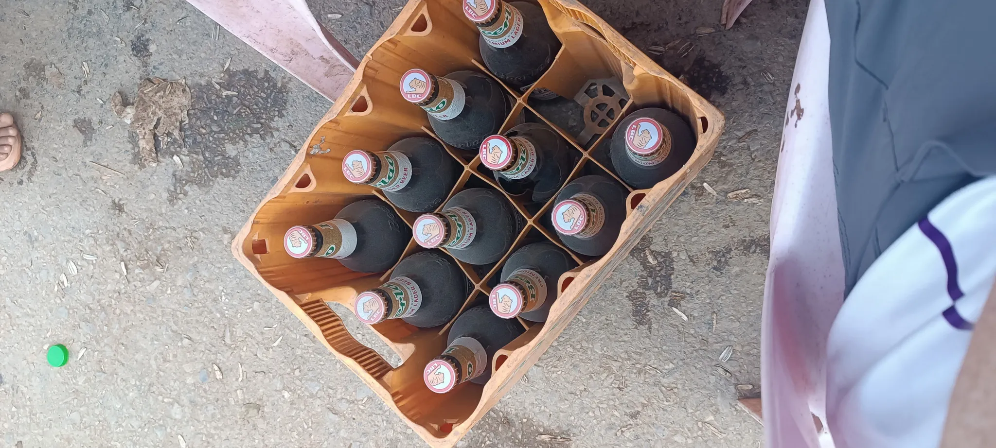 Crate of Beerlao bottles on the ground at a community party in Muang Khua