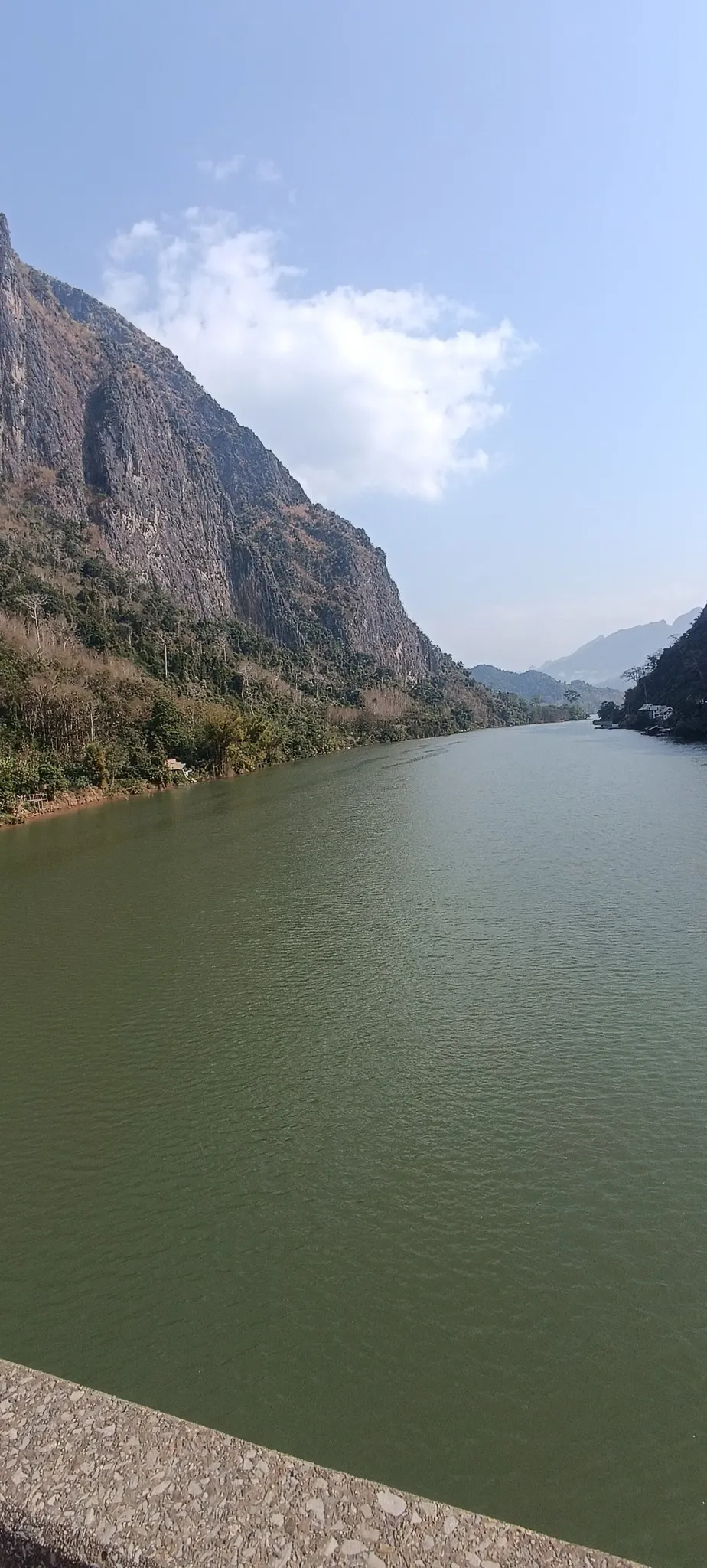 Portrait view of the Nam Ou river cutting through a dramatic karst gorge near Nong Khiaw