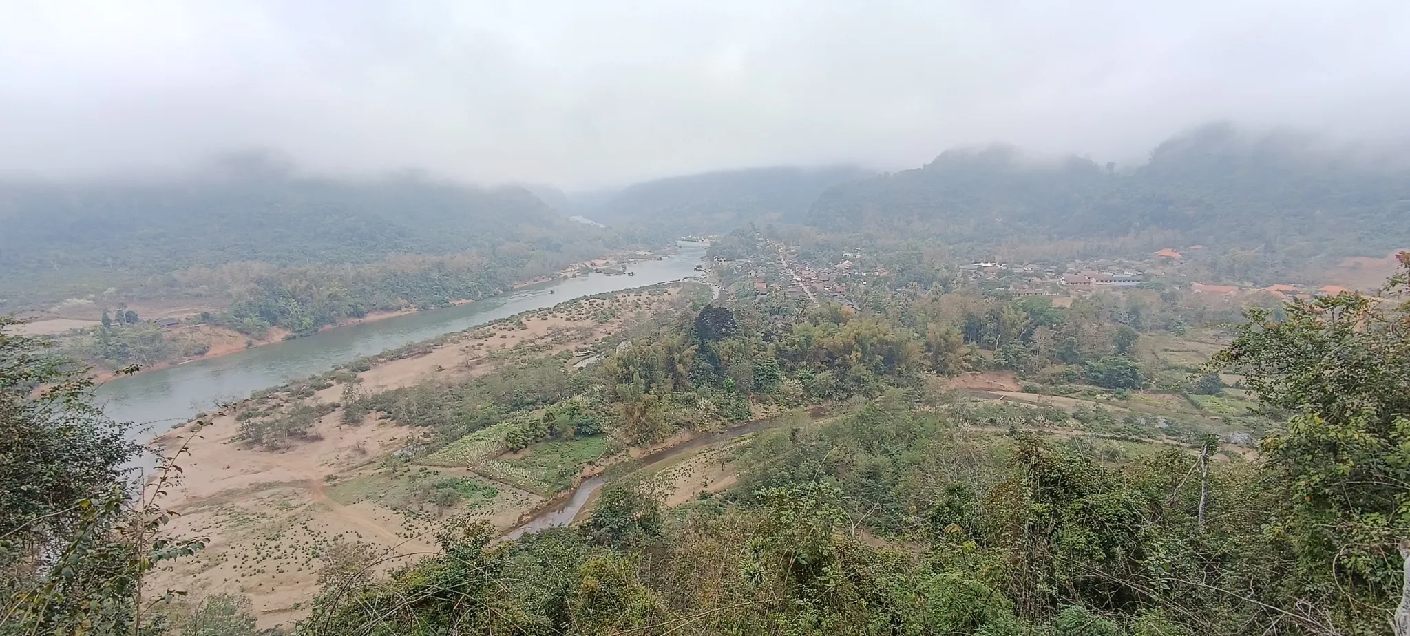 View of the Nam Ou river valley and Muang Ngoi village from the hillside hiking trail