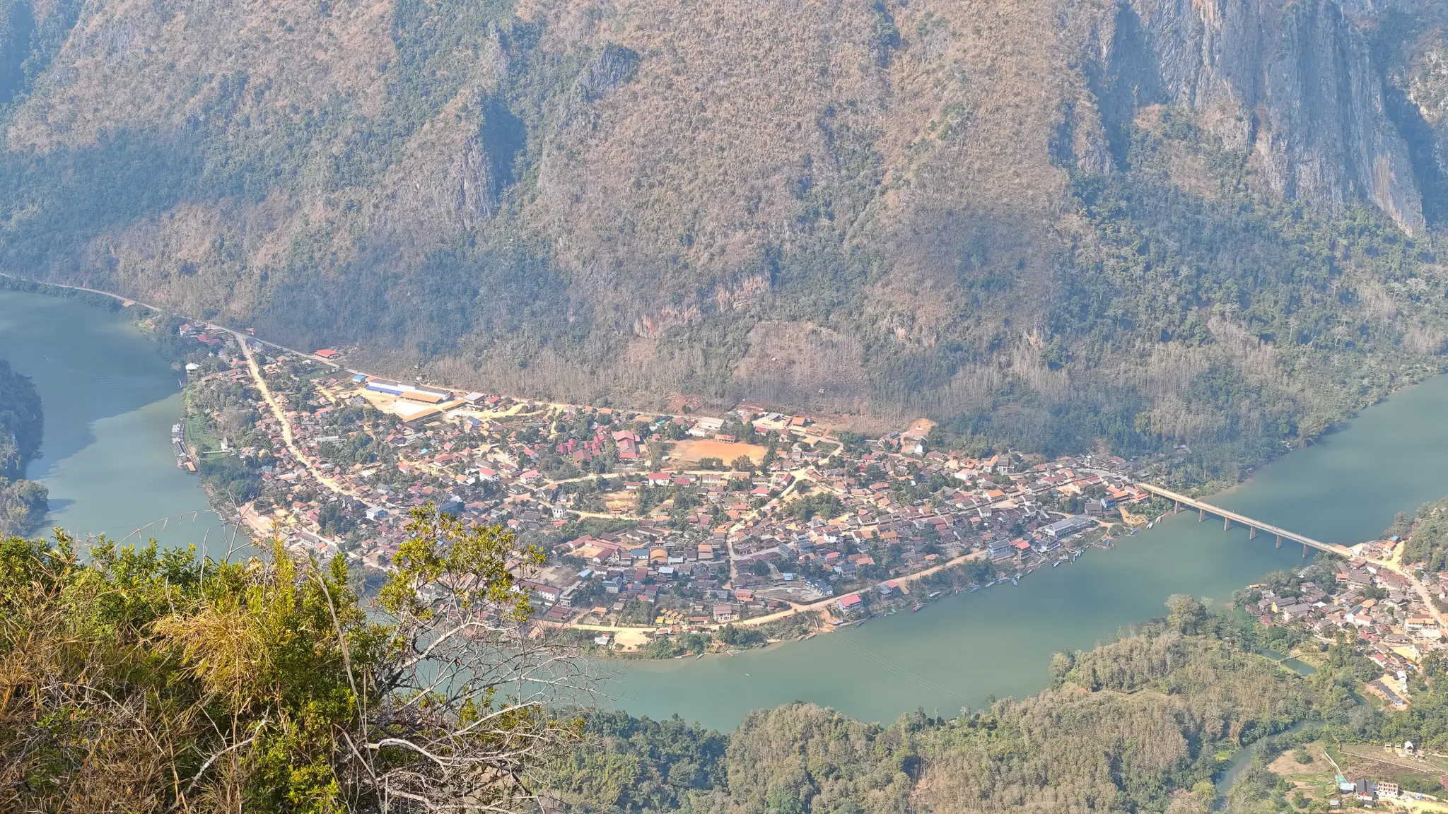 View from Pha Kew Lom showing Nong Khiaw bridge and the river bend with karst mountains beyond