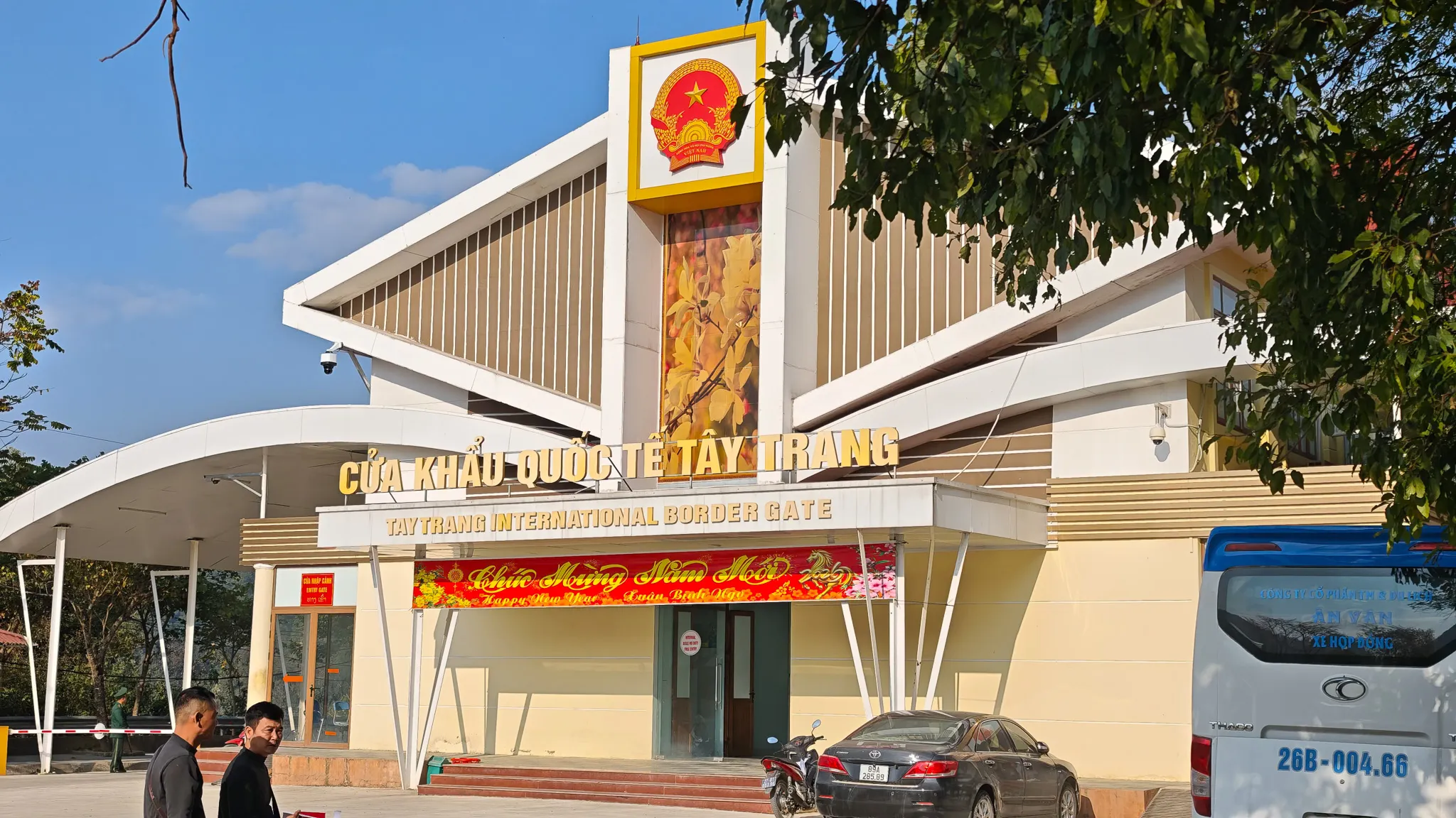 Tay Trang International Border Gate building on the Vietnam-Laos border with Vietnamese national emblem and Lunar New Year decorations