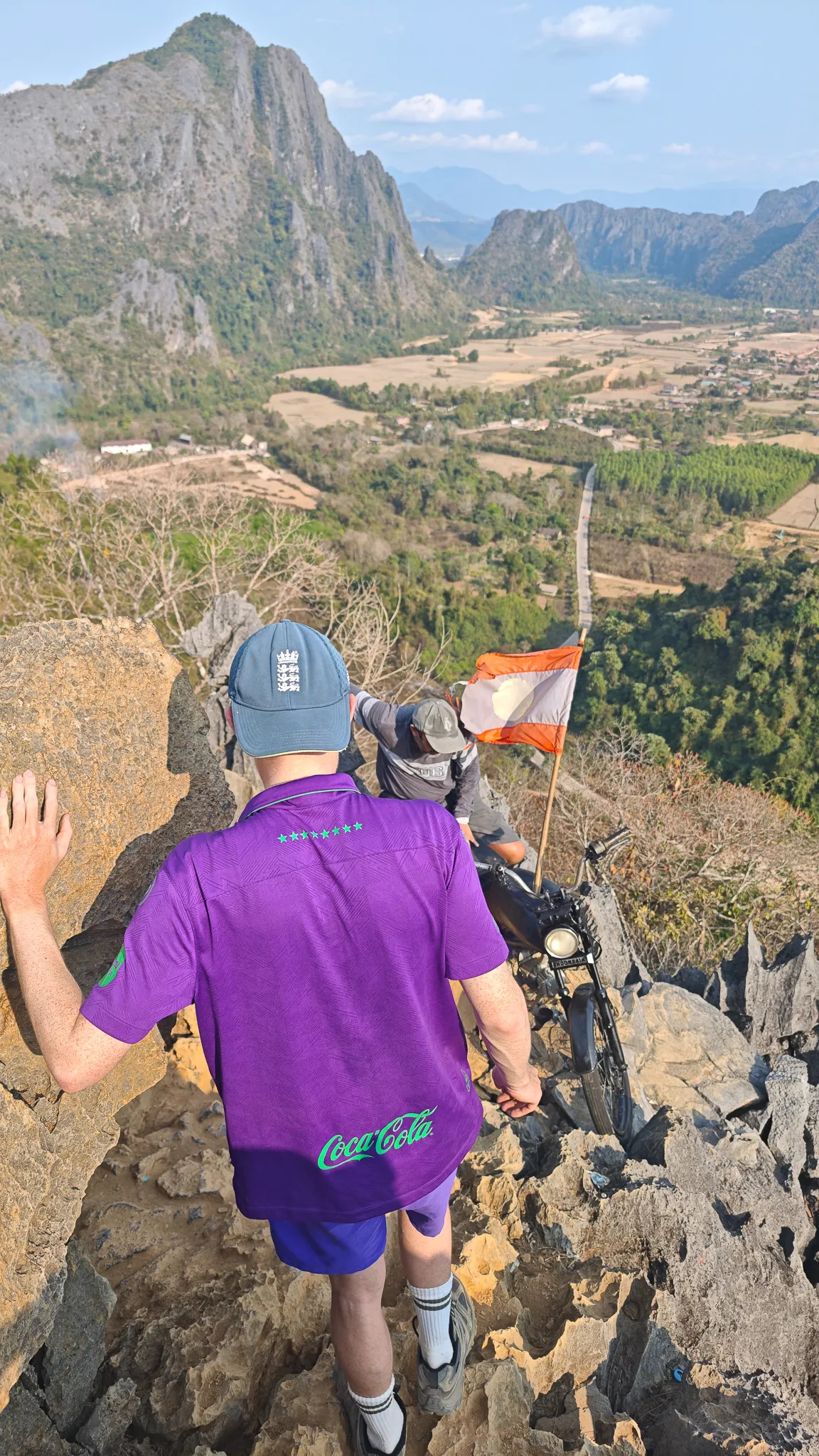 Panoramic view from Nam Xay viewpoint showing karst mountains and the Vang Vieng valley below