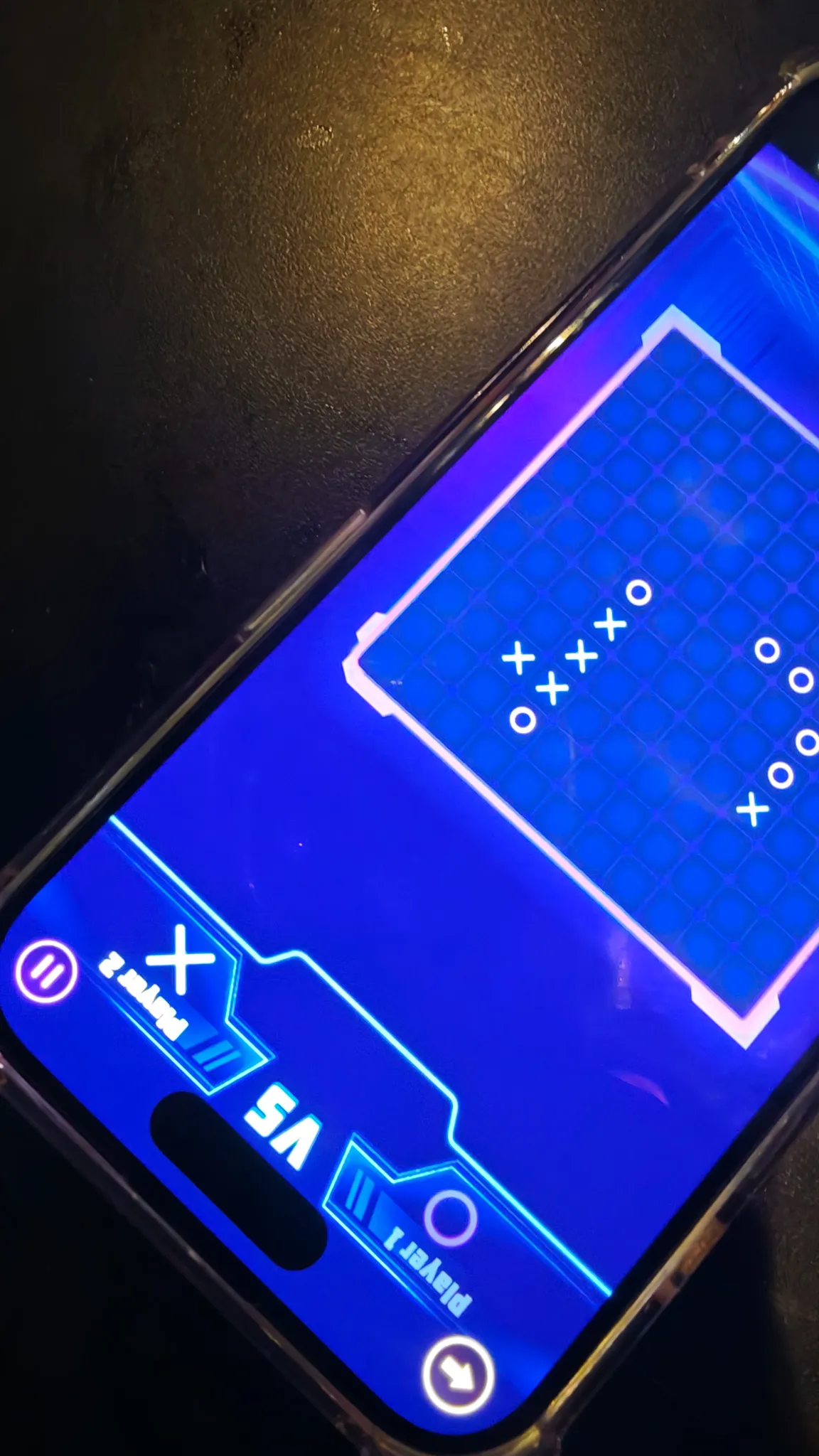 Connect Four game being played on a phone at night during downtime in Vientiane