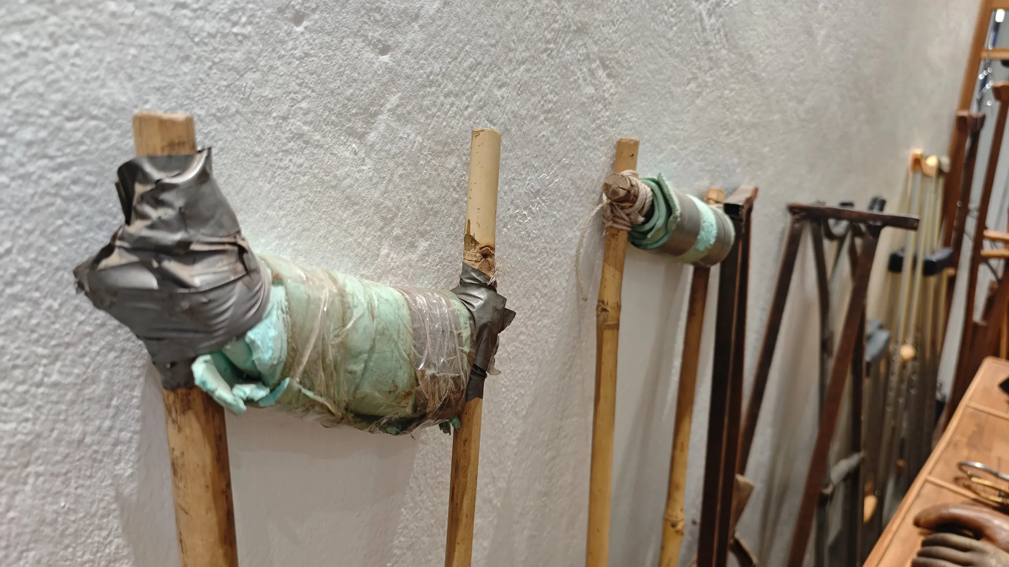 Makeshift bamboo and tape crutches on display at the COPE Centre in Vientiane showing the impact of UXOs in Laos