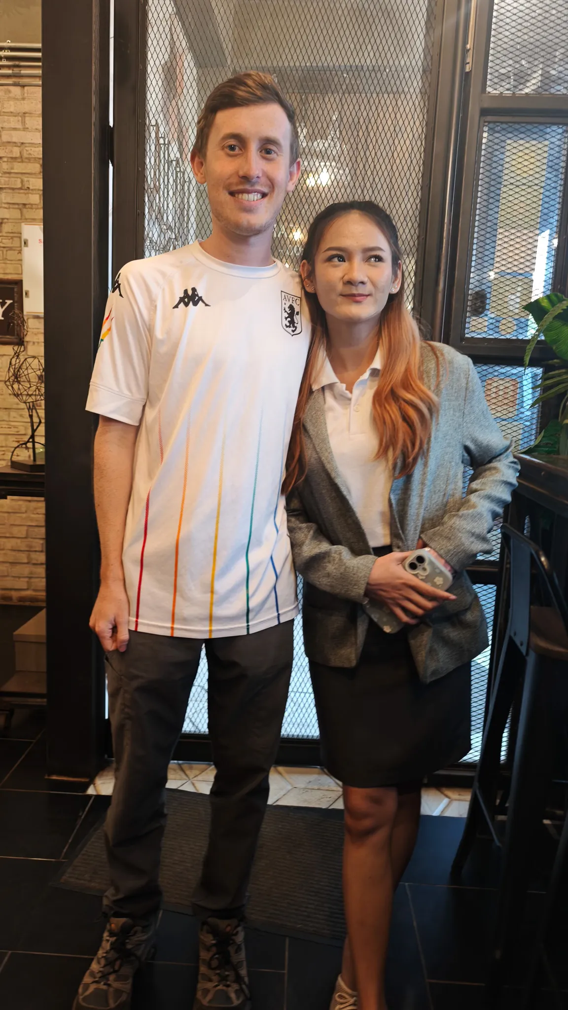 Smiling goodbye portrait with a Lao friend at the Sly cafe in Vientiane on the final day in Laos